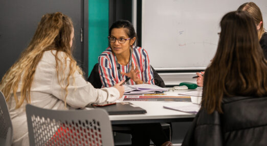 female teacher with teenage students