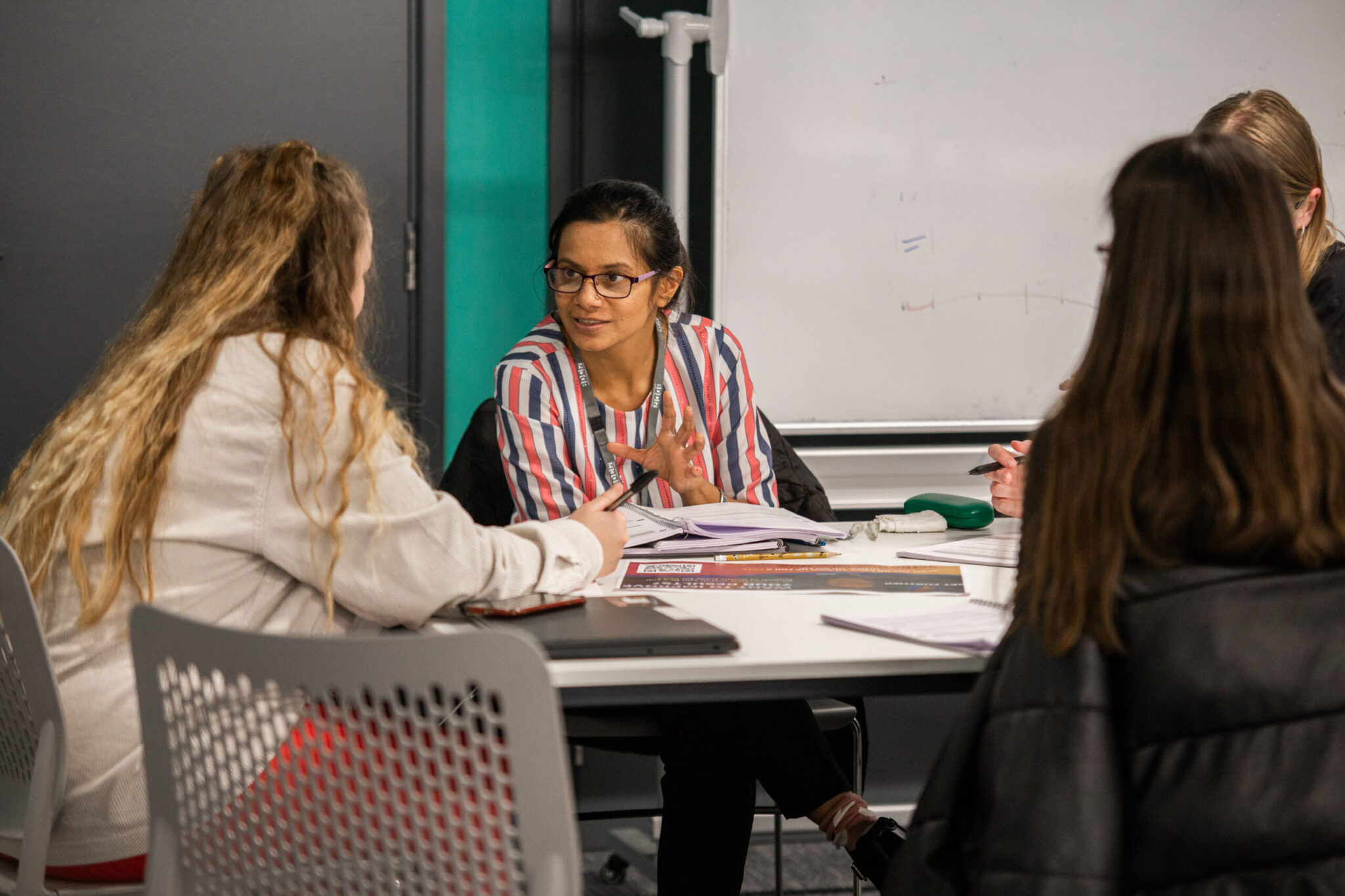 female teacher with teenage students